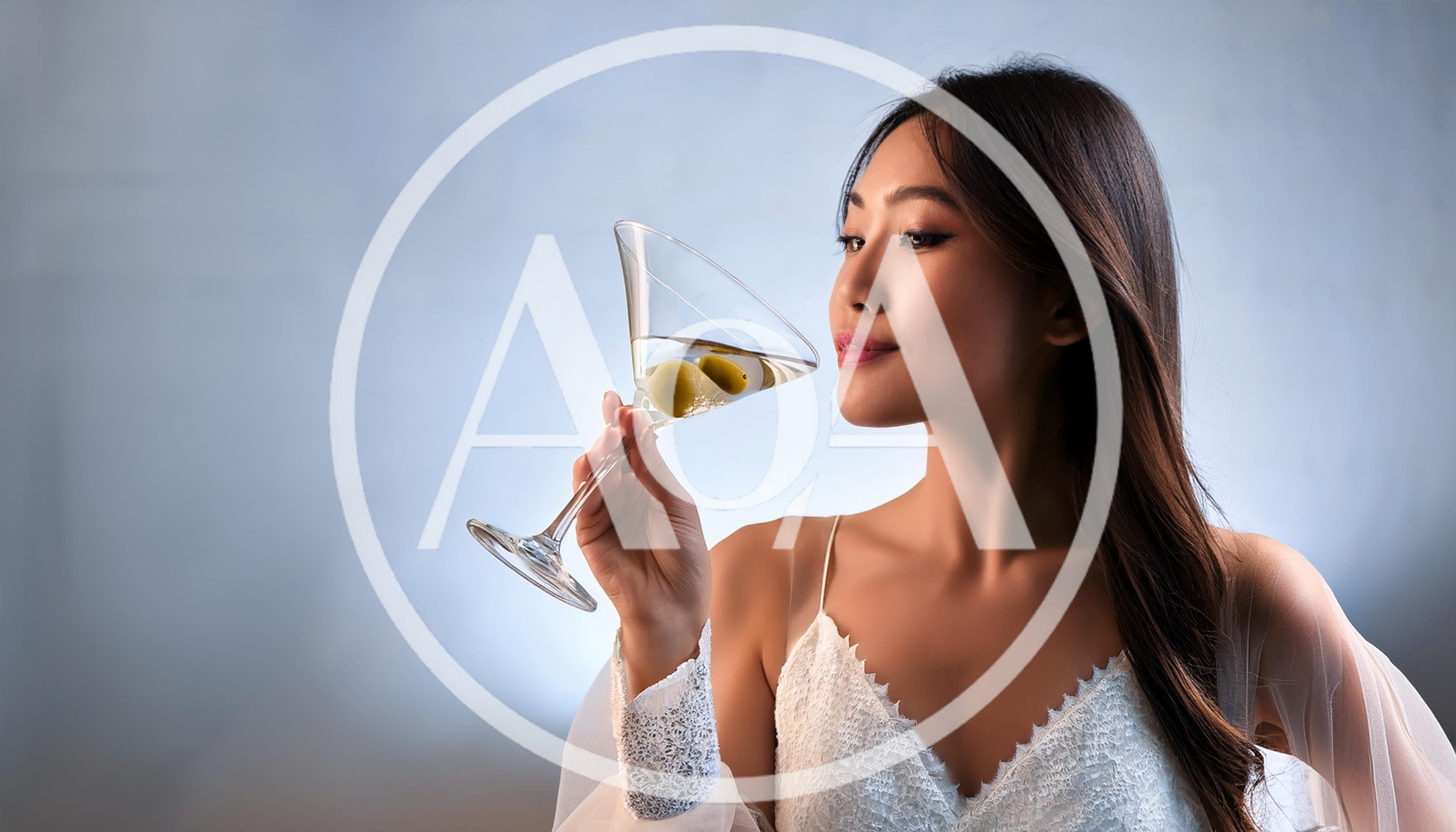 Elegant Asian Woman Holding A Martini Glass