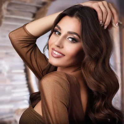 Portrait Of A Beautiful Woman With Wavy Brown Hair