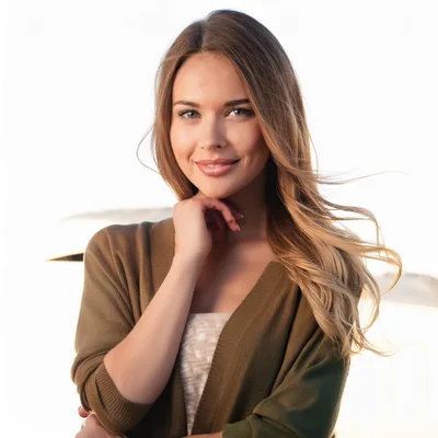 Portrait Of A Smiling Young Woman Outdoors