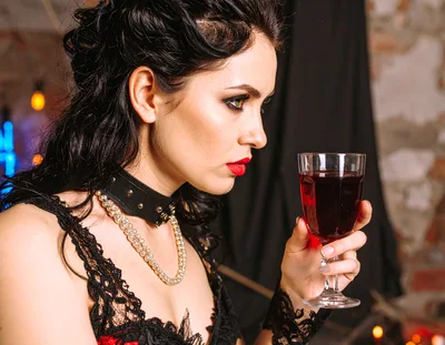 Gothic Woman Holding A Glass Of Red Wine