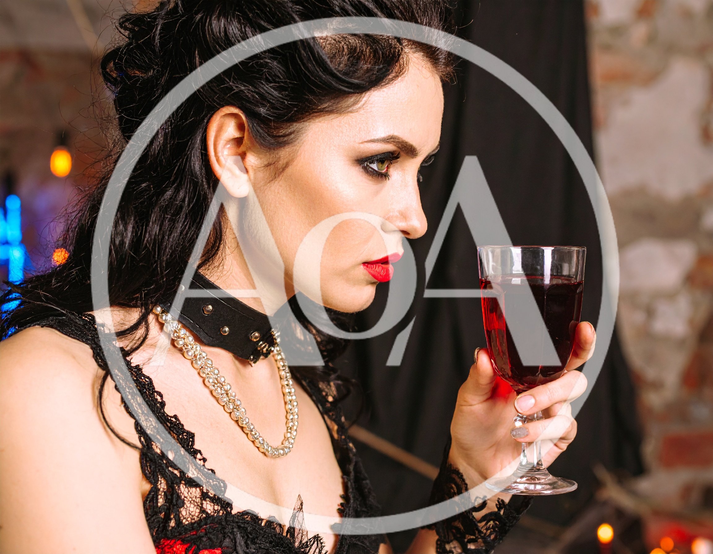 Gothic Woman Holding A Glass Of Red Wine