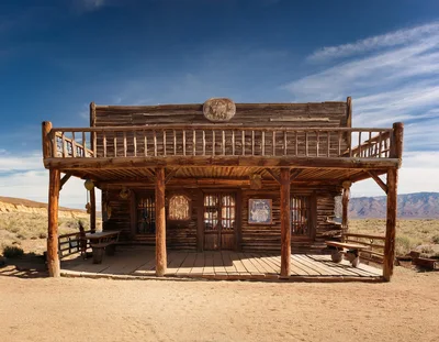 Old Western Wooden Saloon Building In Desert Landscape