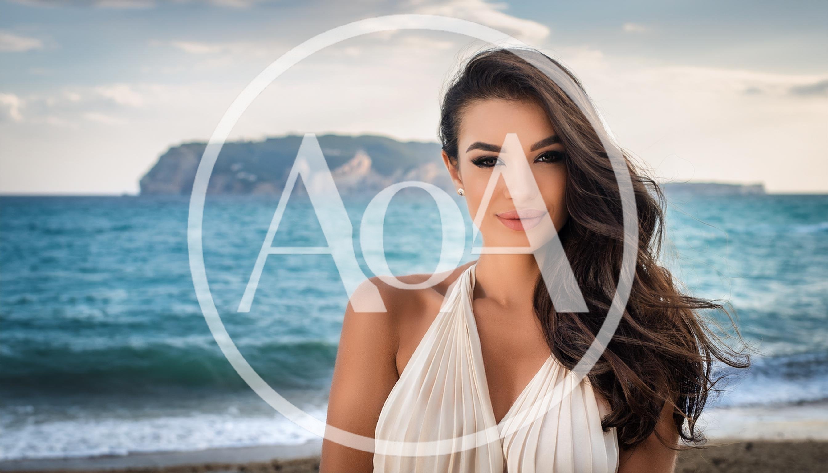 Beautiful Woman Posing On A Mediterranean Beach