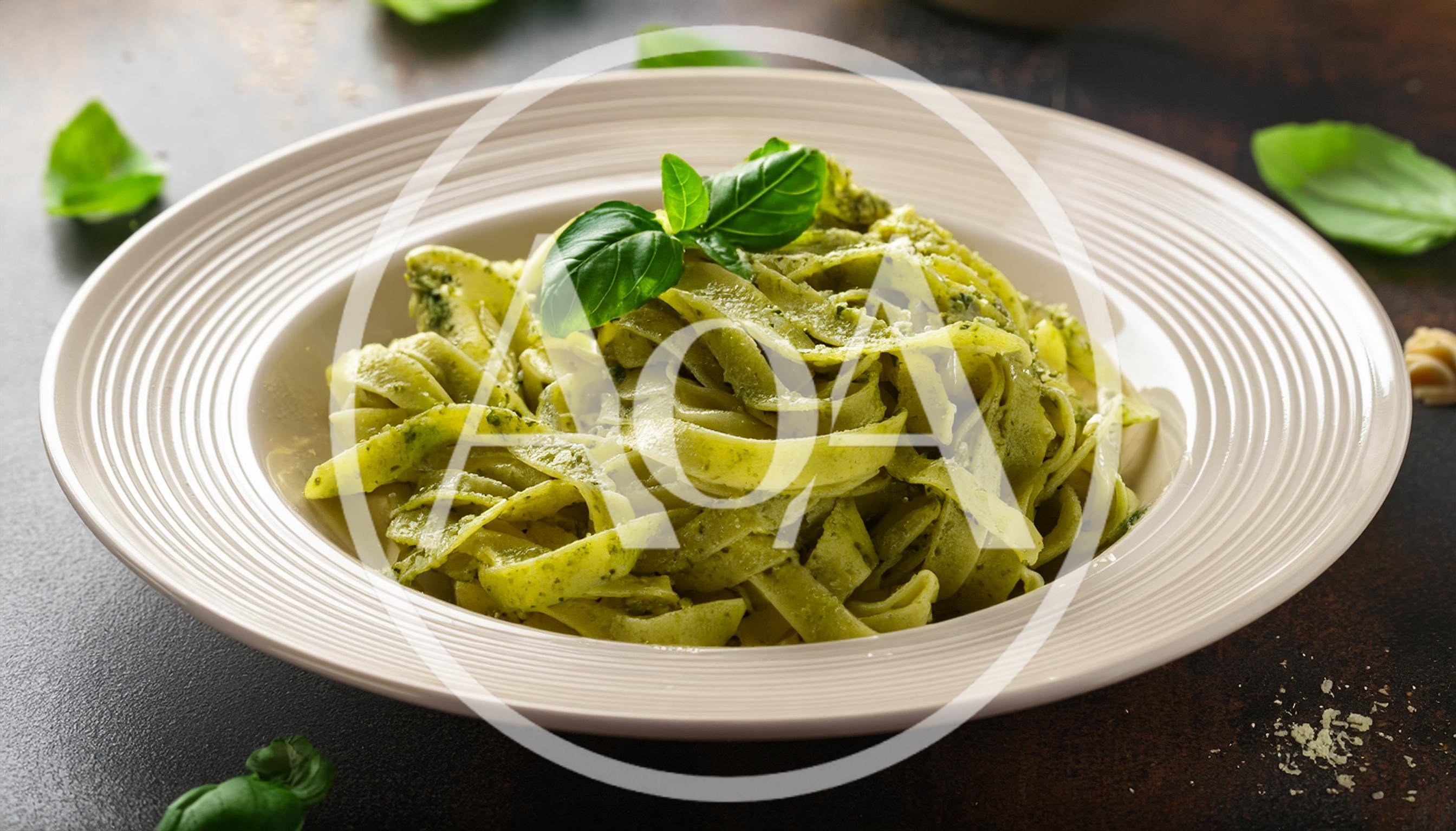 Plate Of Fresh Fettuccine Pasta With Pesto Sauce