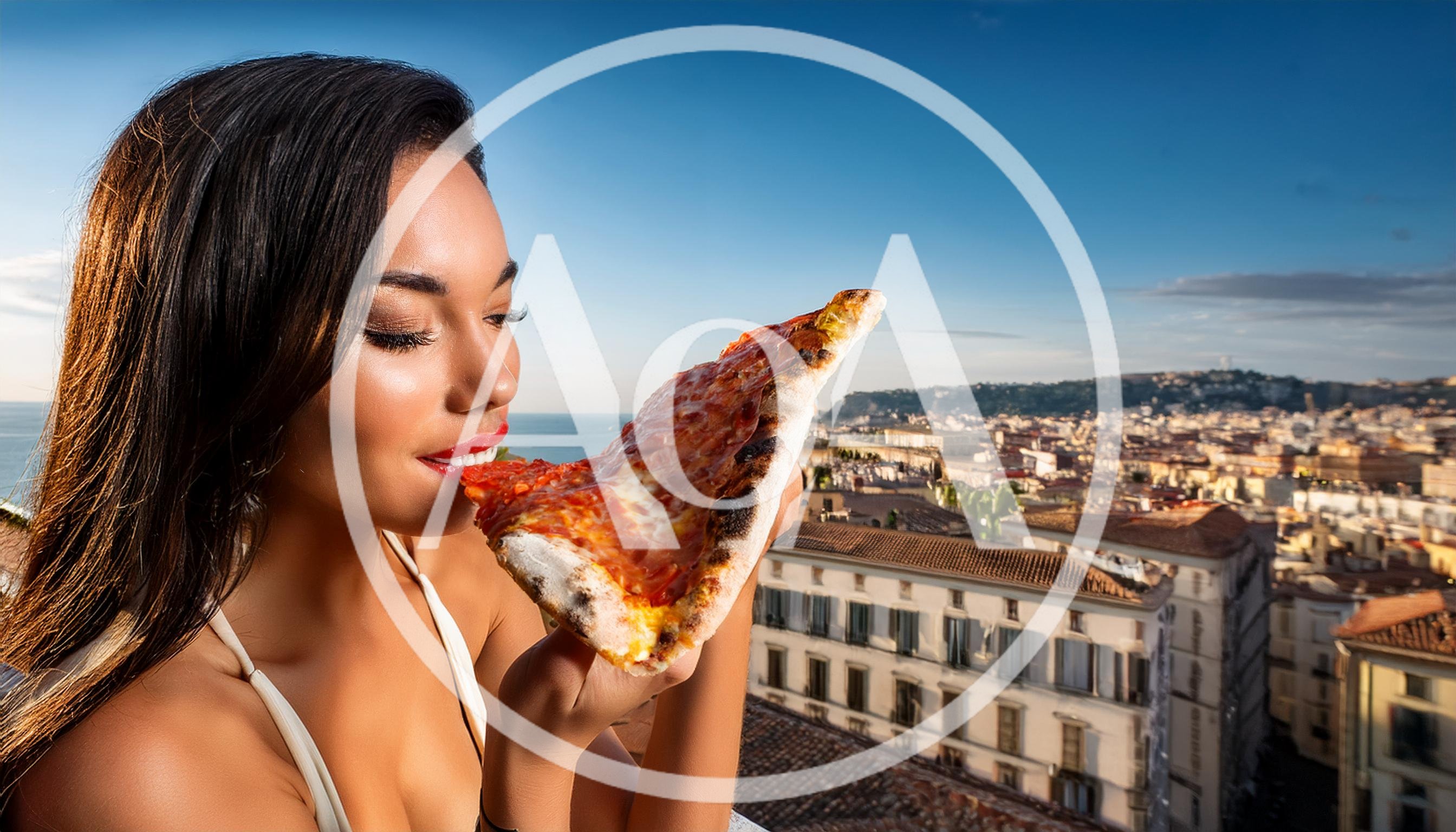 Young Woman Eating Pizza Slice Overlooking Naples Cityscape