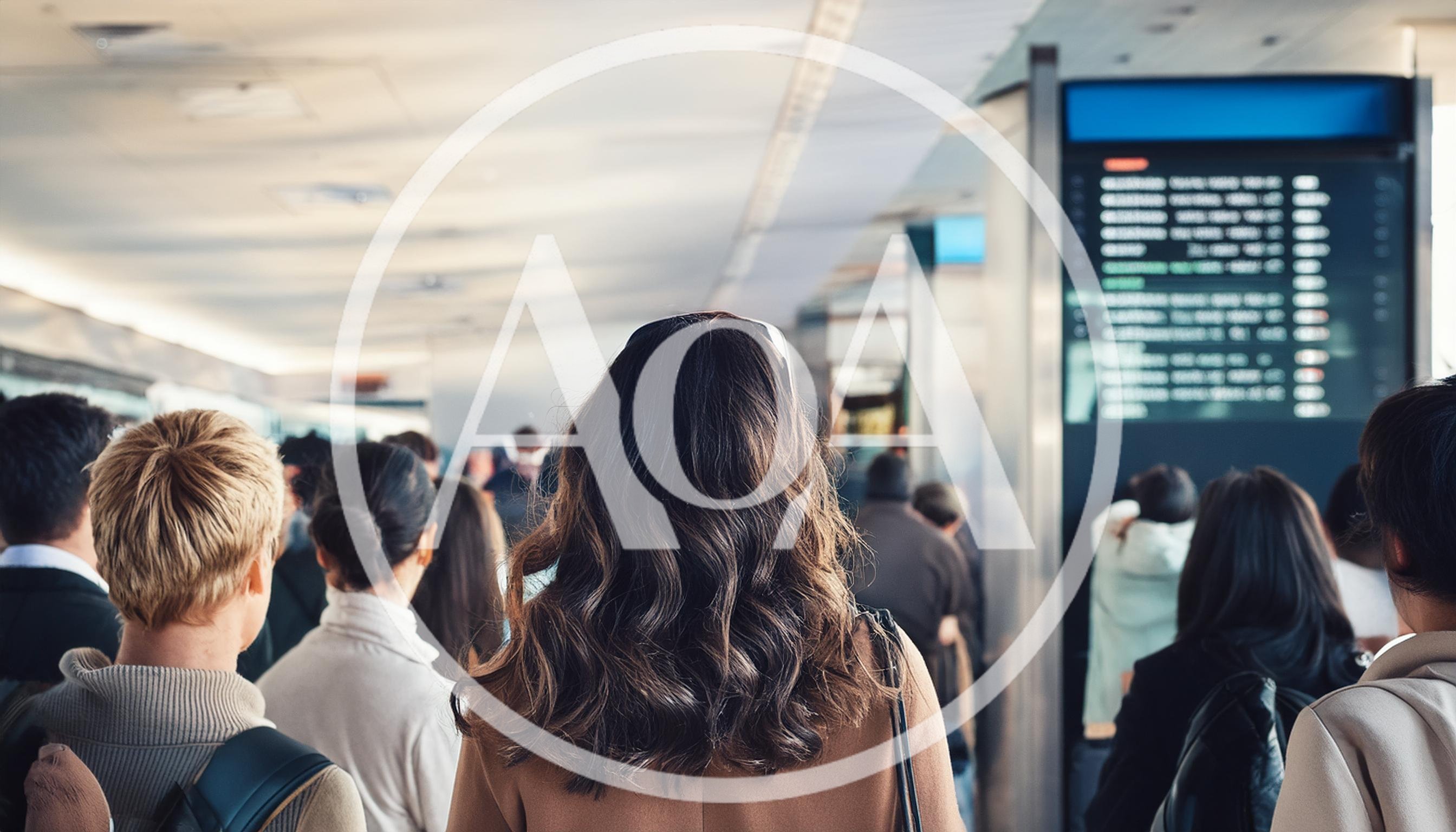 Commuters Waiting In Line At An Airport Terminal
