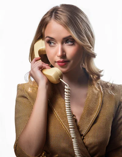 Elegant Blonde Woman Talking On Vintage Telephone