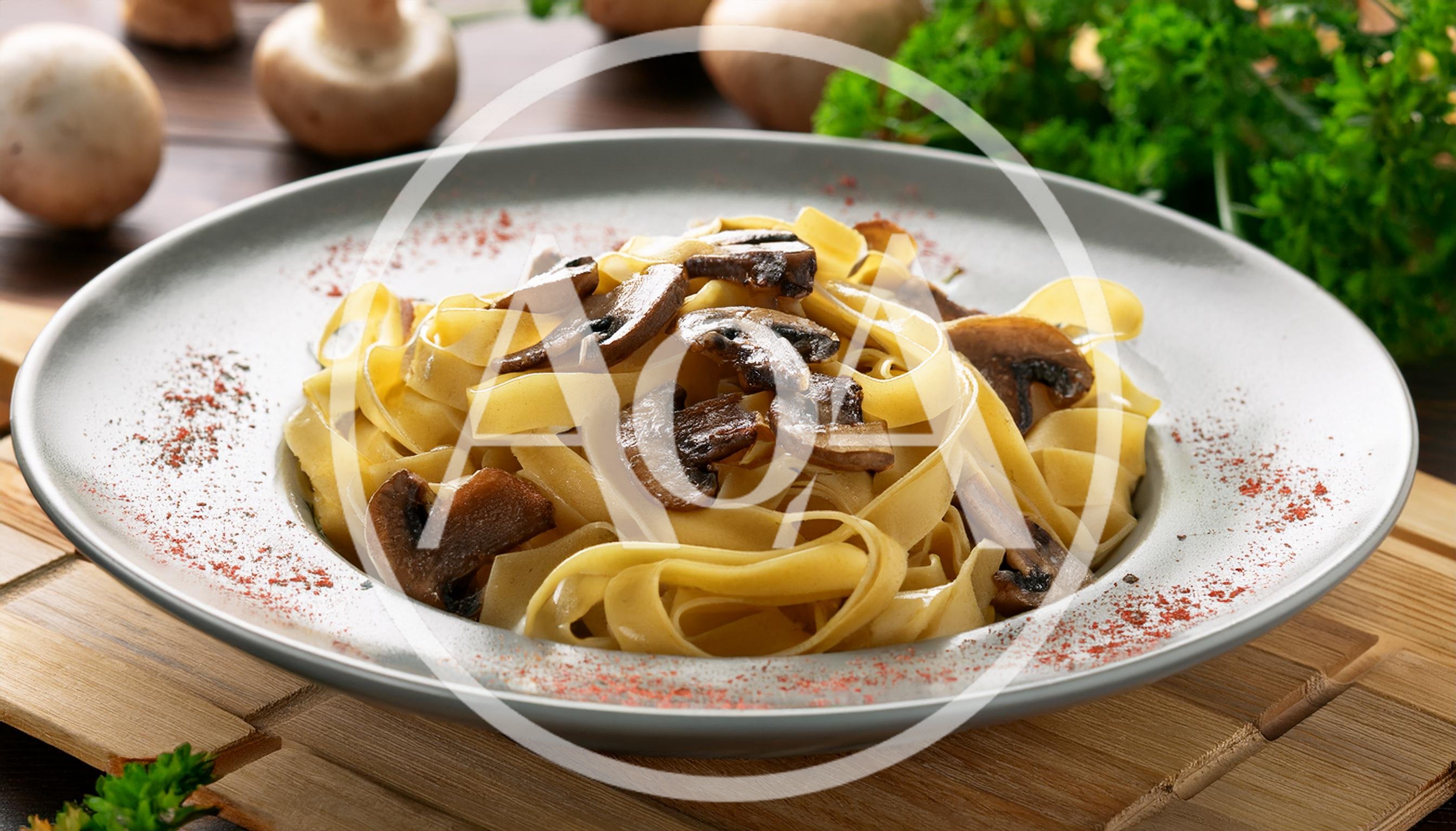 Mushroom Fettuccine Pasta Dish on Wooden Table