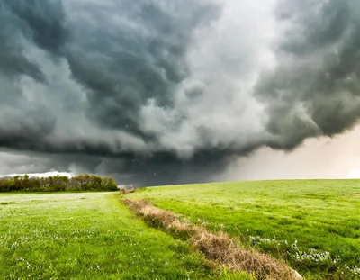 Dramatic Storm Clouds Over A Green Rural Field