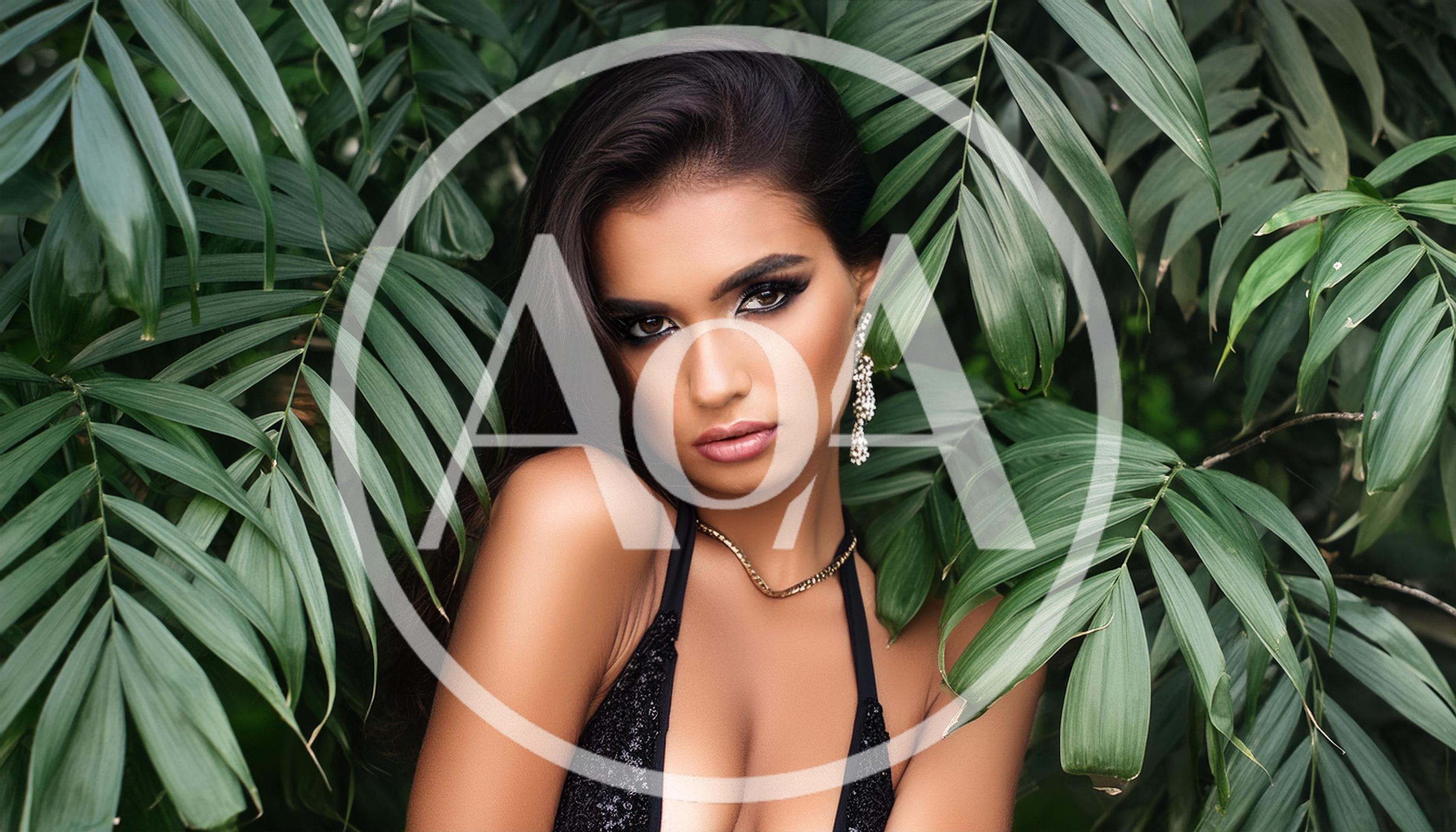 Portrait Of A Beautiful Woman In Tropical Foliage
