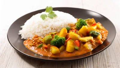 Vegetable Curry With Steamed White Rice On Plate