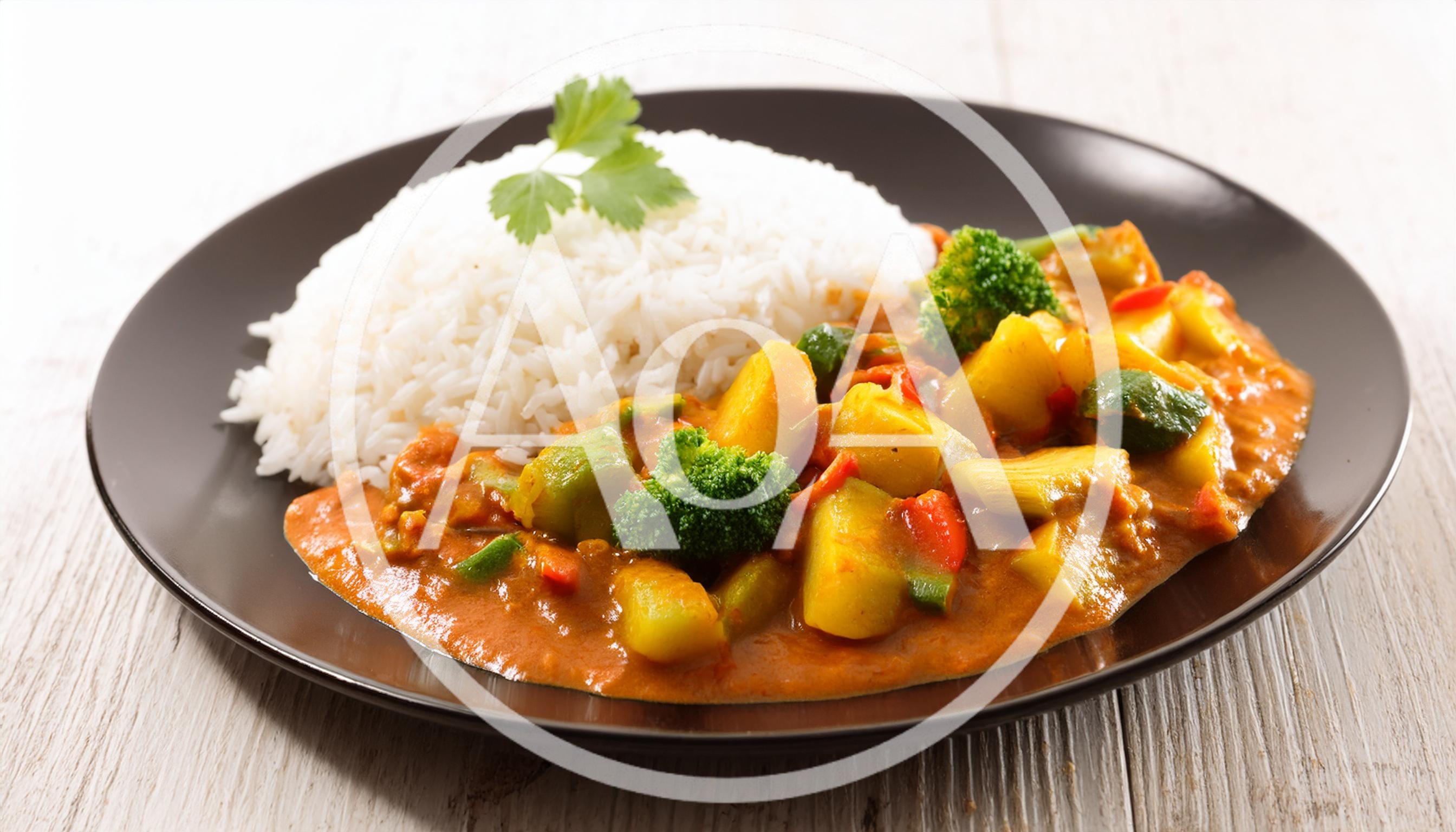 Vegetable Curry With Steamed White Rice On Plate