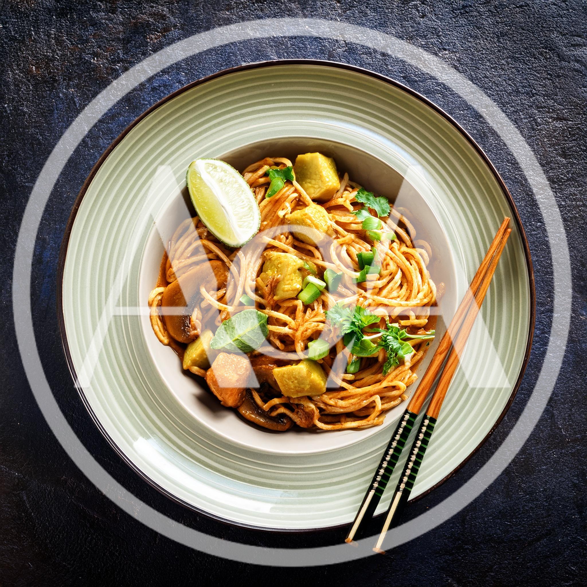 Bowl Of Spicy Vegetable Noodles With Lime
