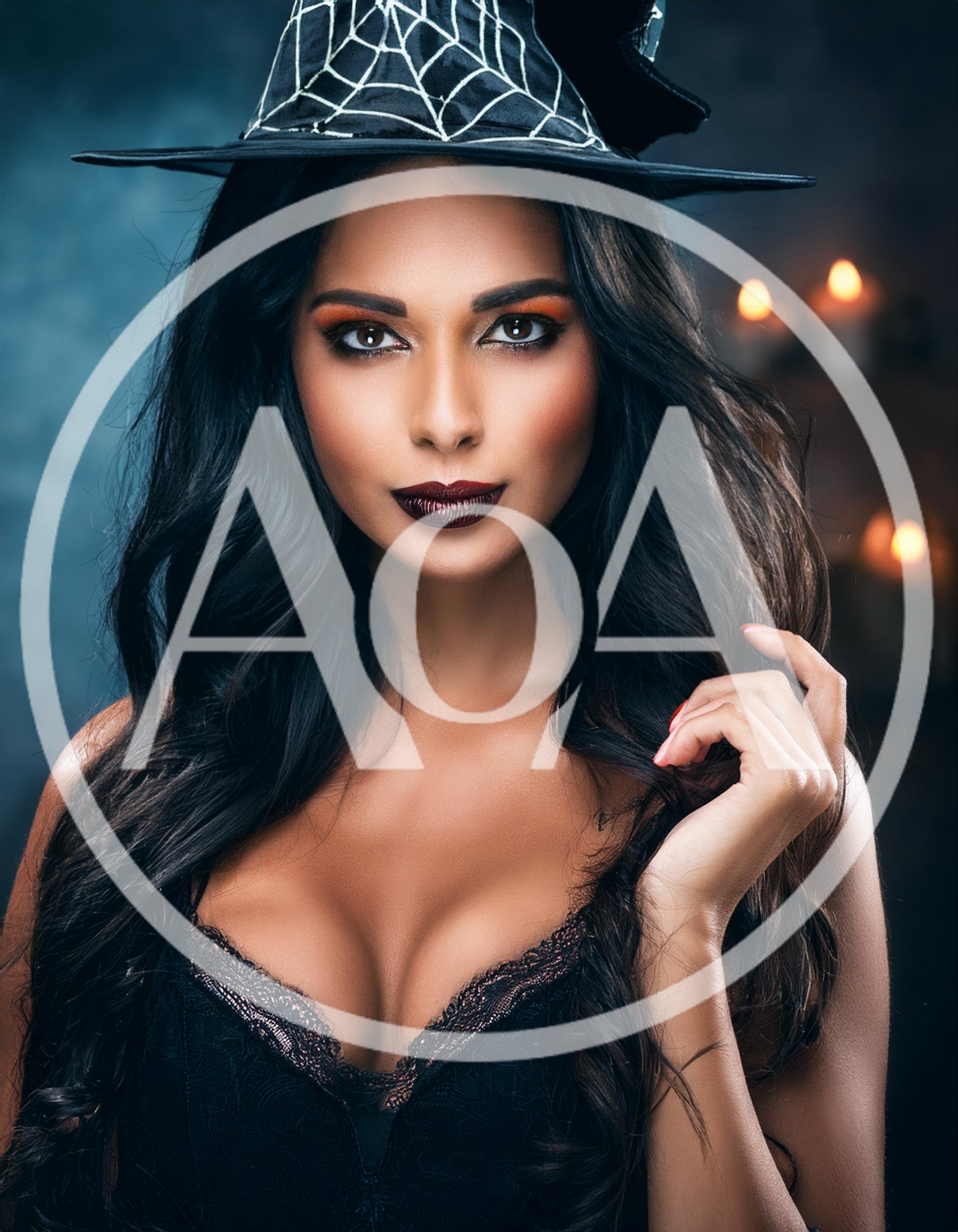 Beautiful Woman Wearing Witch Hat For Halloween Portrait