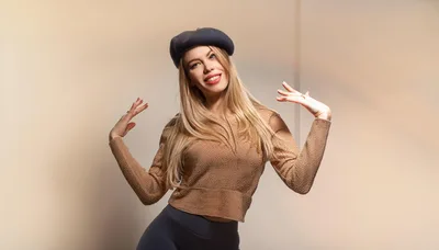 Young Woman Posing In A Beret And Sweater