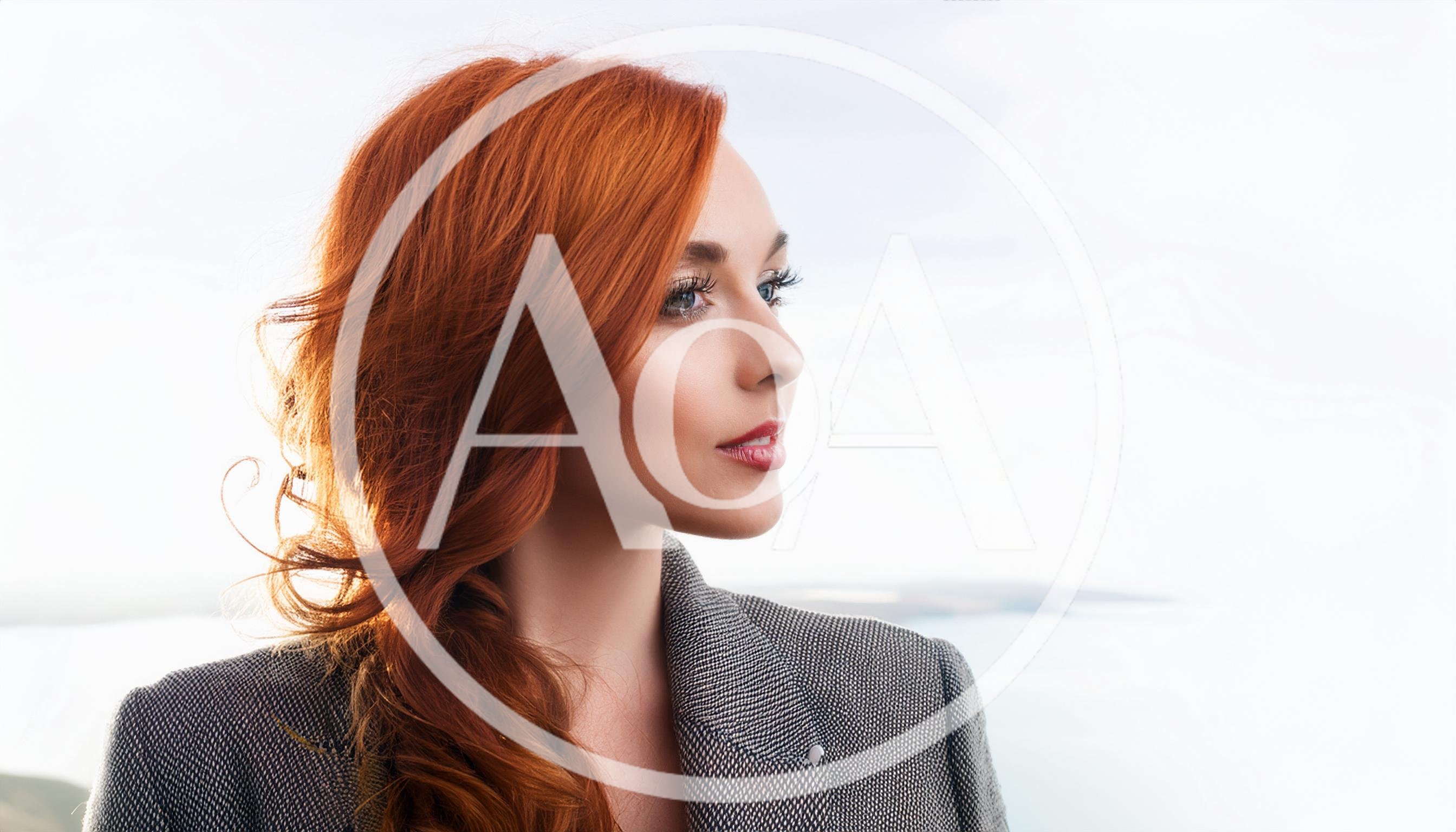 Portrait Of A Beautiful Woman With Red Hair