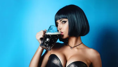 Woman With Bob Haircut Drinking Dark Beer