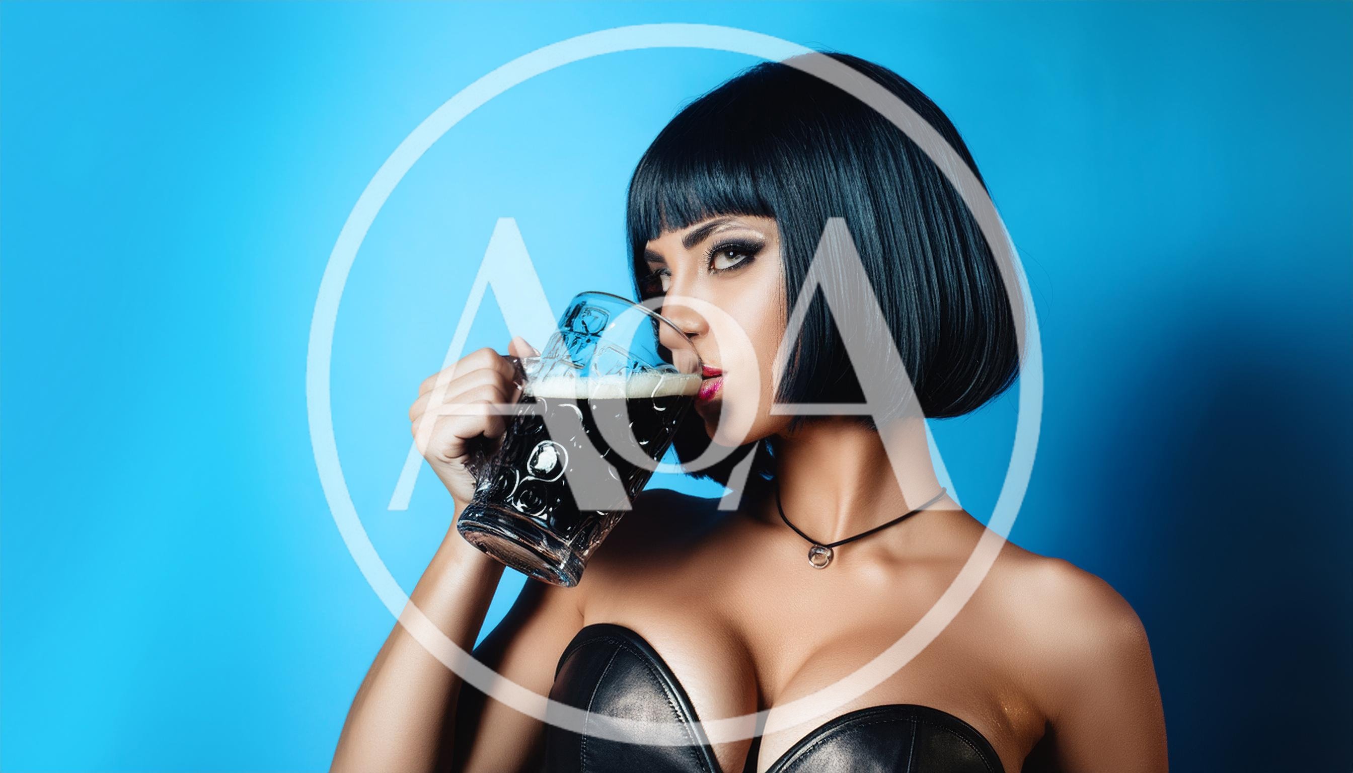 Woman With Bob Haircut Drinking Dark Beer
