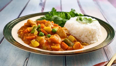 Vegetable Curry With Steamed White Rice On Plate