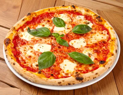Fresh Margherita Pizza On A Wooden Table