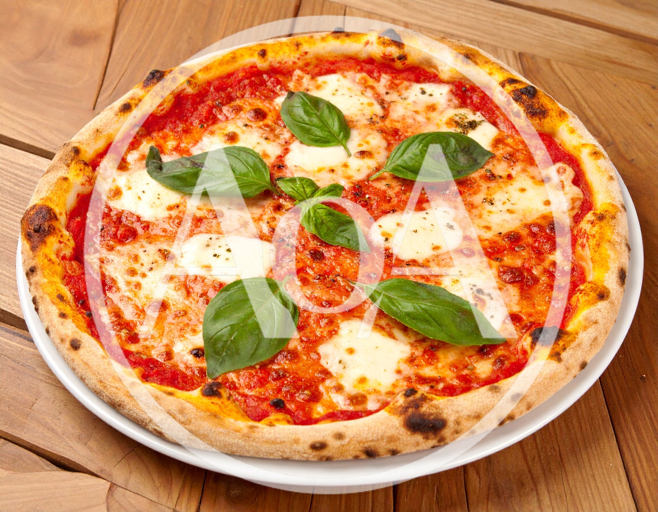 Fresh Margherita Pizza On A Wooden Table