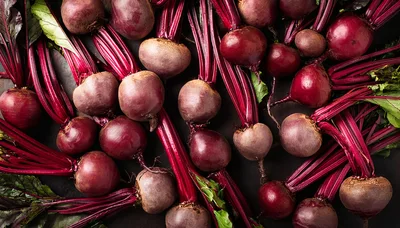 Fresh Raw Beetroots With Green Leaves On Dark Background