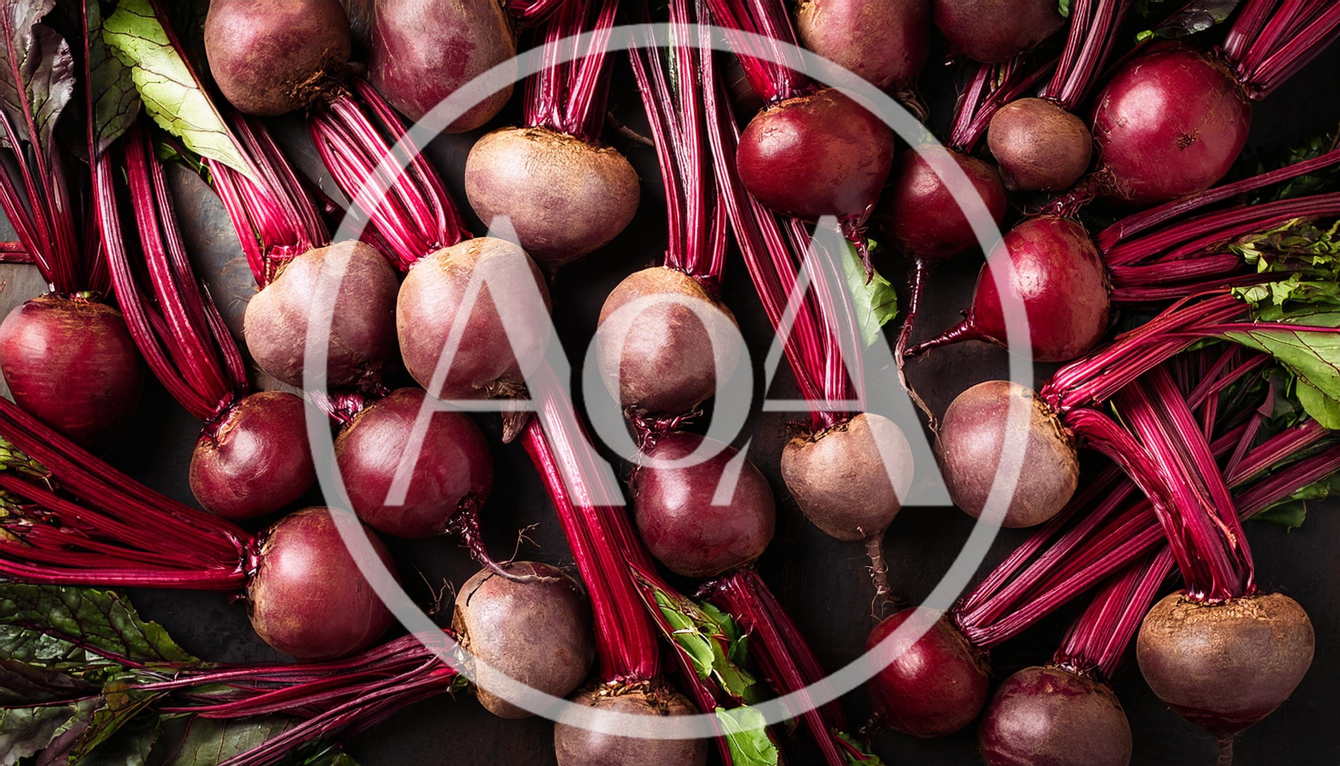Fresh Raw Beetroots With Green Leaves On Dark Background
