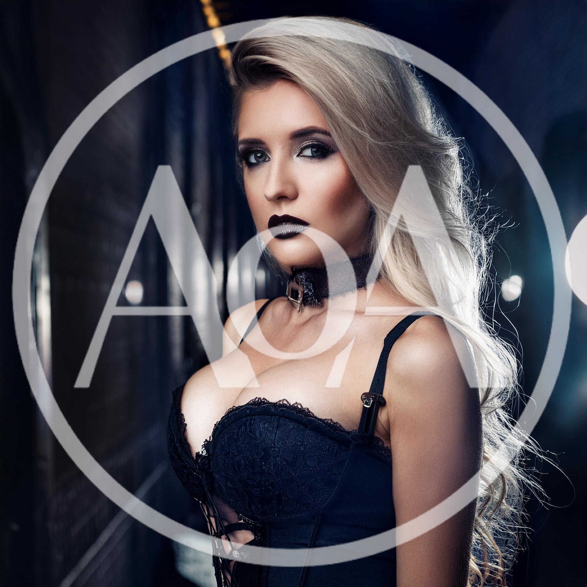 Portrait Of A Blonde Woman In Gothic Lingerie