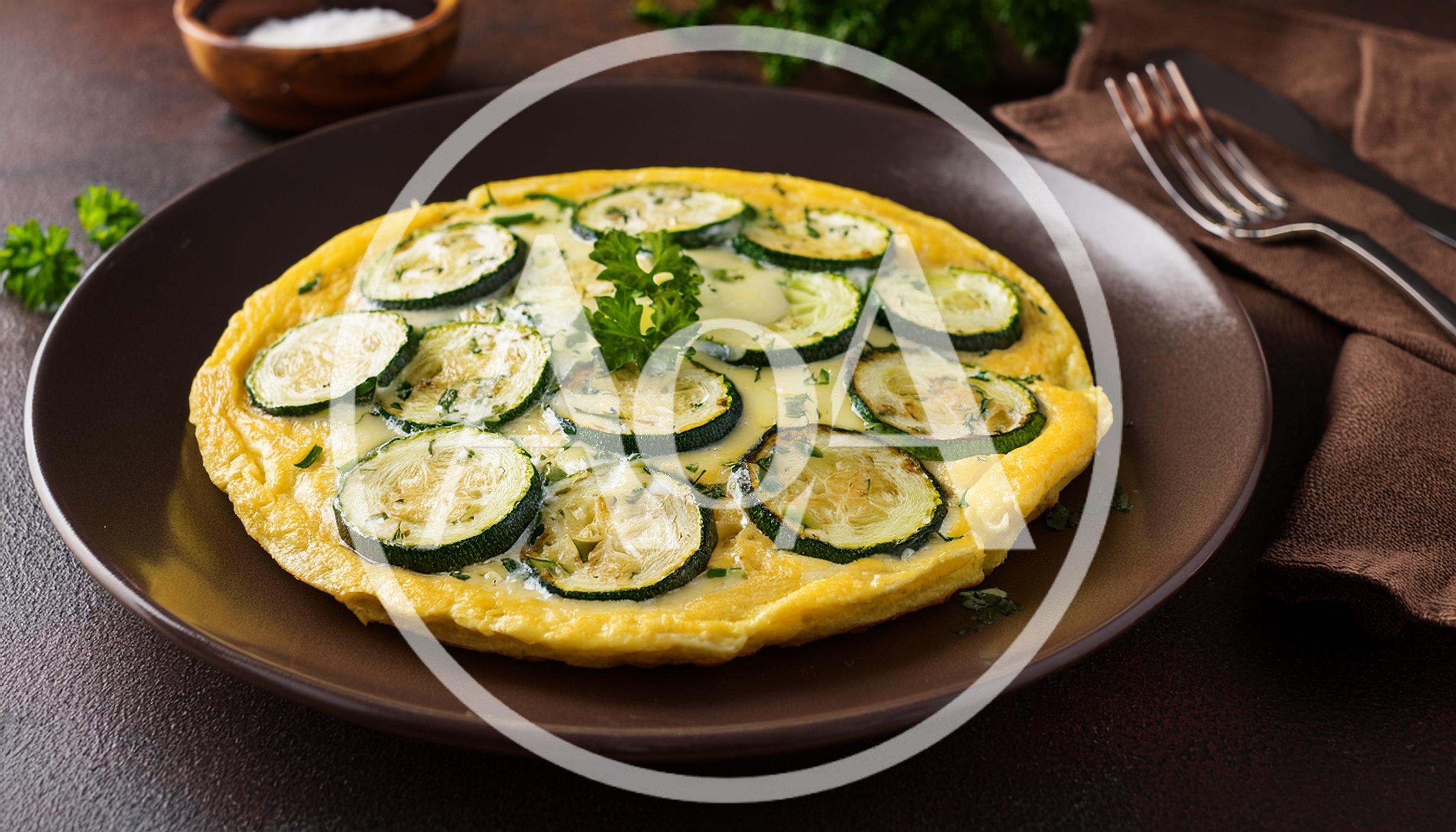 Zucchini Frittata Served on a Dark Plate