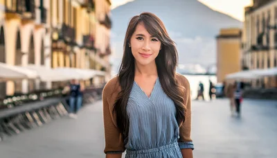 Young Asian Woman Smiling In A European Town Square