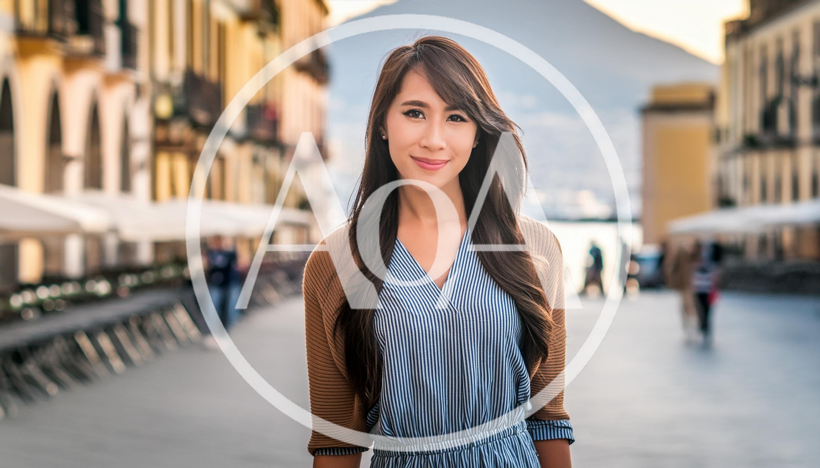 Young Asian Woman Smiling In A European Town Square