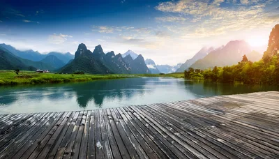 Wooden Pier Overlooking Karst Mountains And River