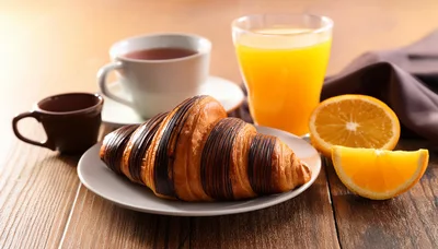 Chocolate Drizzled Croissant Breakfast With Orange Juice