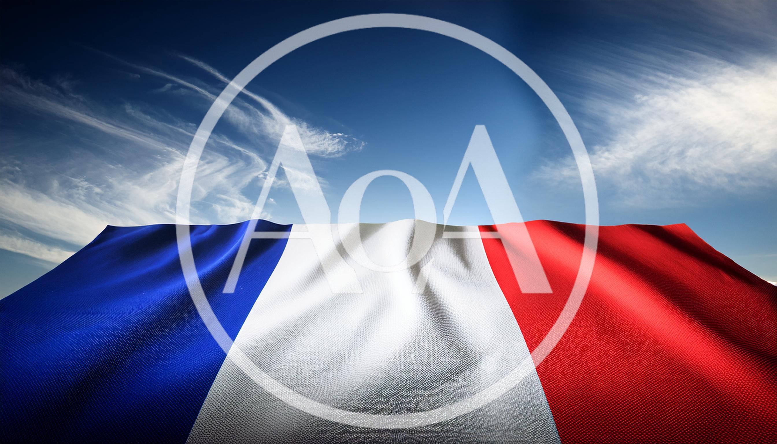 Waving French Flag Against A Clear Blue Sky