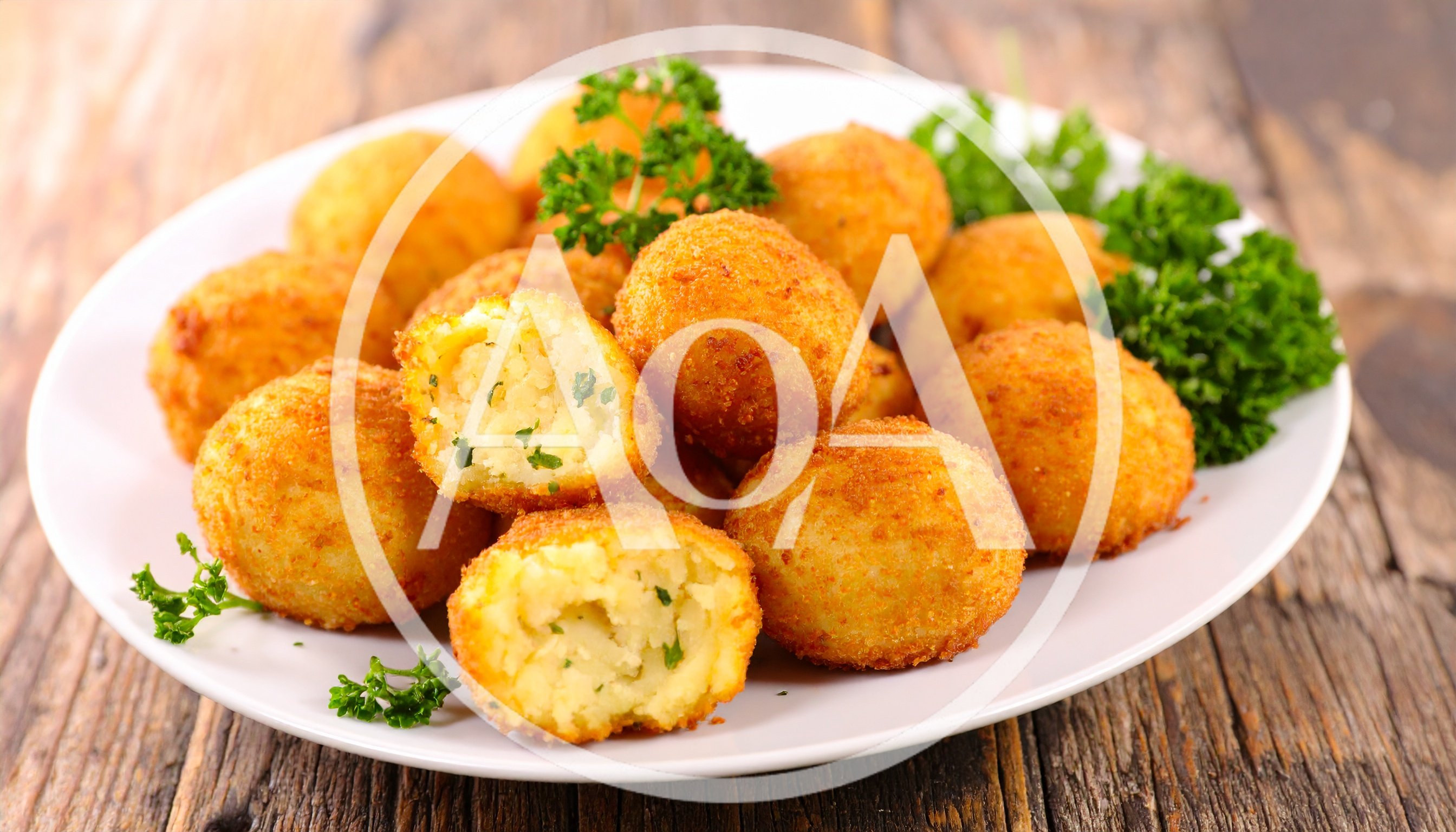 Crispy Fried Potato Croquettes On A White Plate