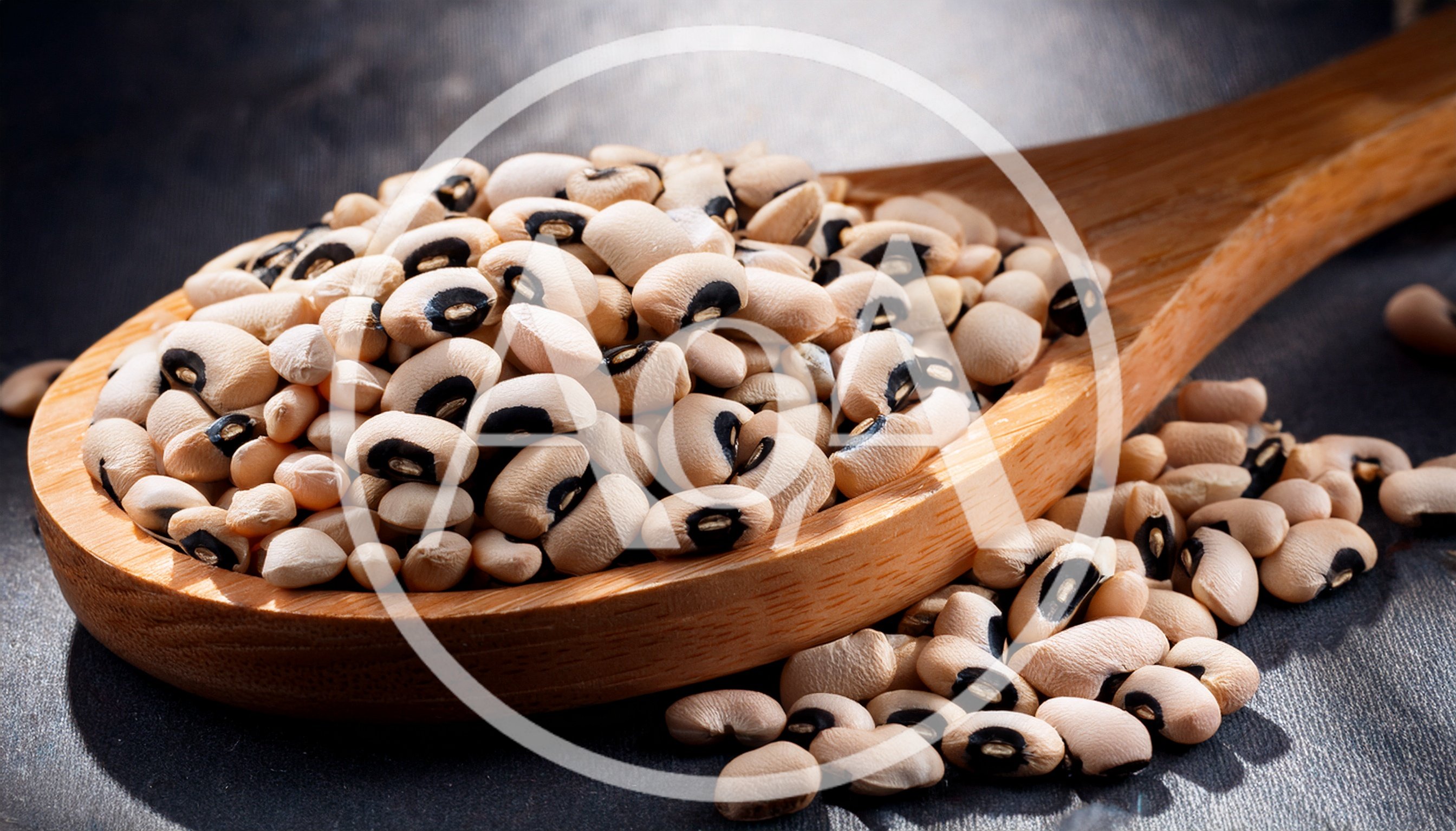Wooden Spoon Filled With Dried Black Eyed Peas