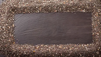 Chia Seeds Border Frame On Dark Slate Background
