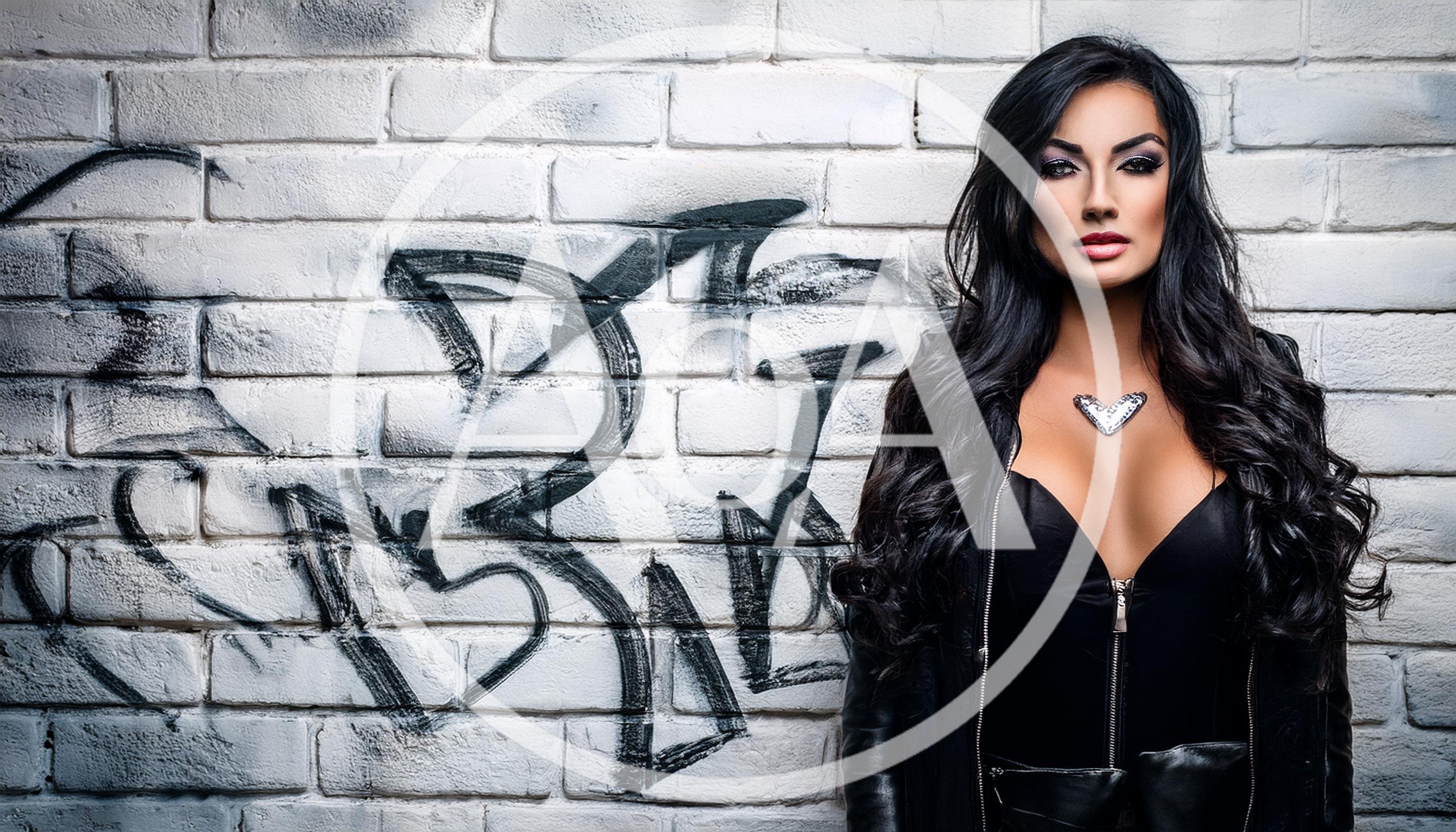 Portrait Of A Glamorous Woman Against A Graffiti Wall