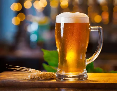 Glass Mug Of Golden Beer With Wheat Stalks