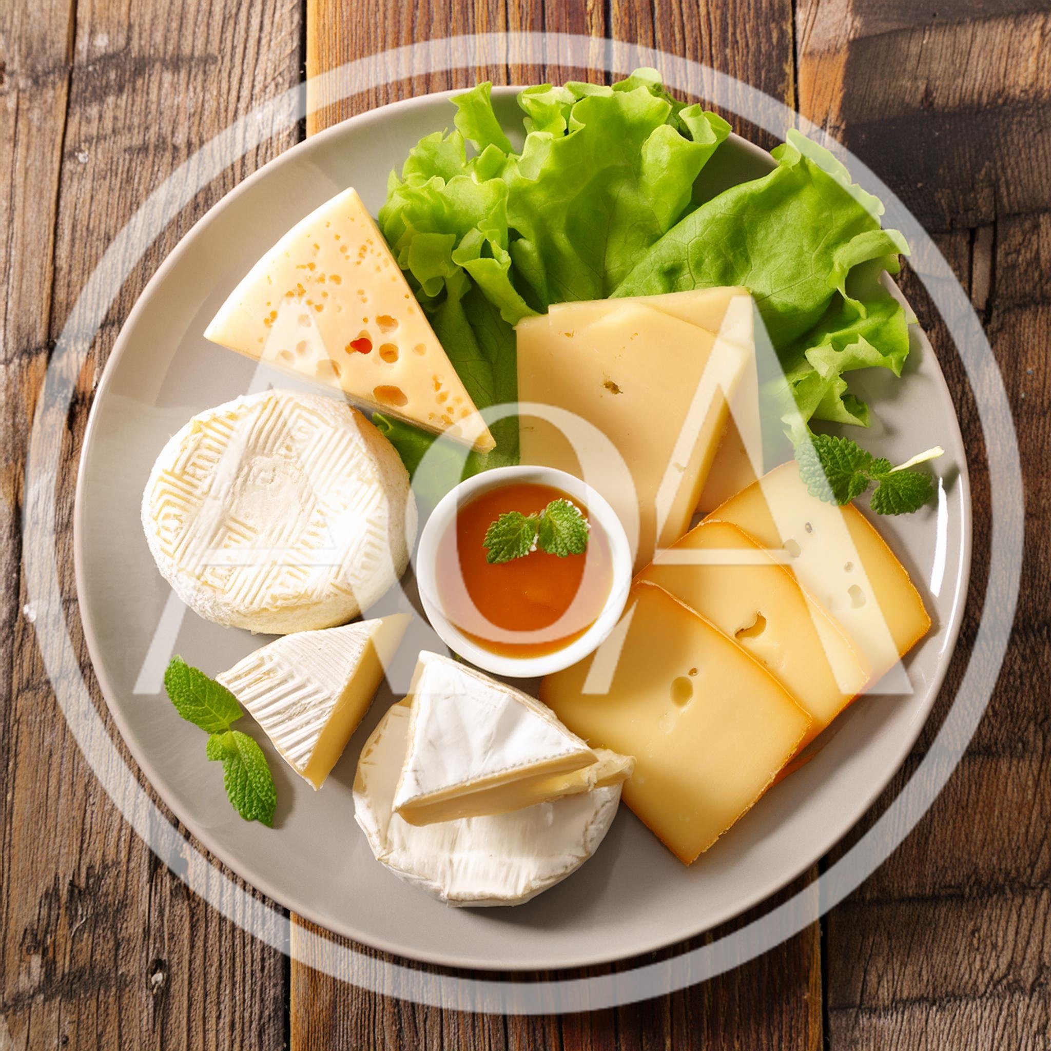 Assorted Cheese Platter With Honey And Lettuce