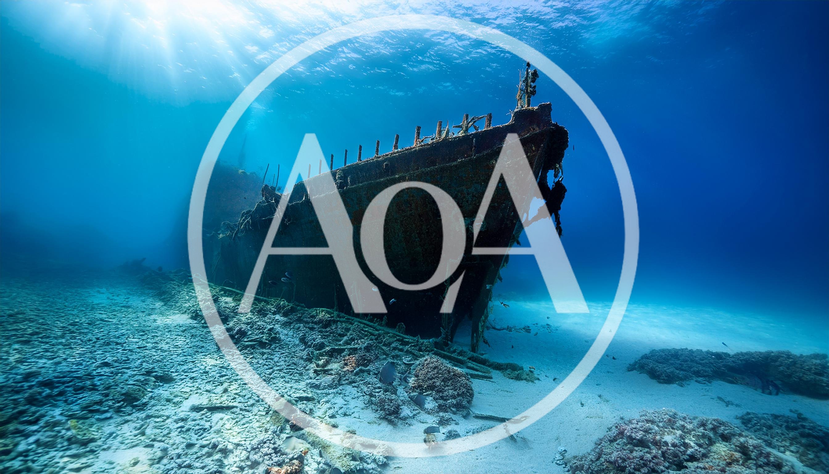 Sunken Shipwreck Resting On The Sandy Ocean Floor