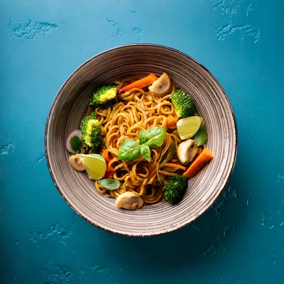 Stir Fried Noodles With Vegetables In A Bowl