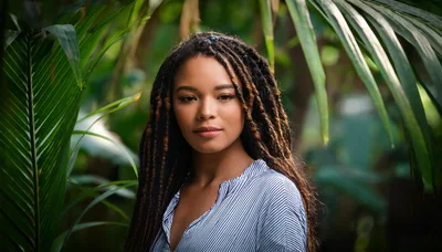 Portrait Of A Young Woman With Braided Hair