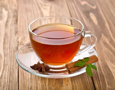 Glass Cup Of Tea With Cinnamon And Star Anise