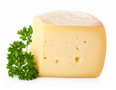Wedge Of Semi Hard Cheese With Fresh Parsley