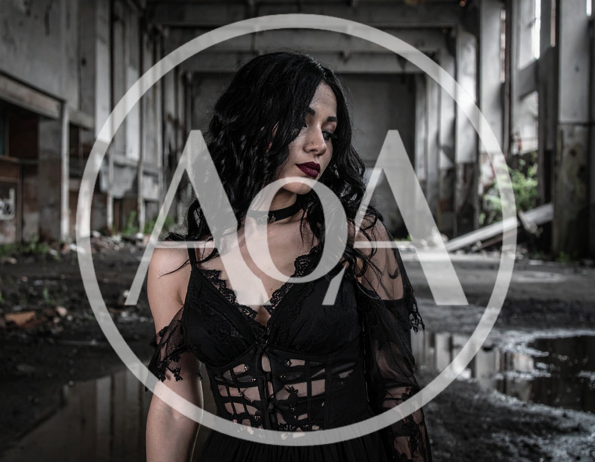 Gothic Woman Standing In An Abandoned Industrial Warehouse