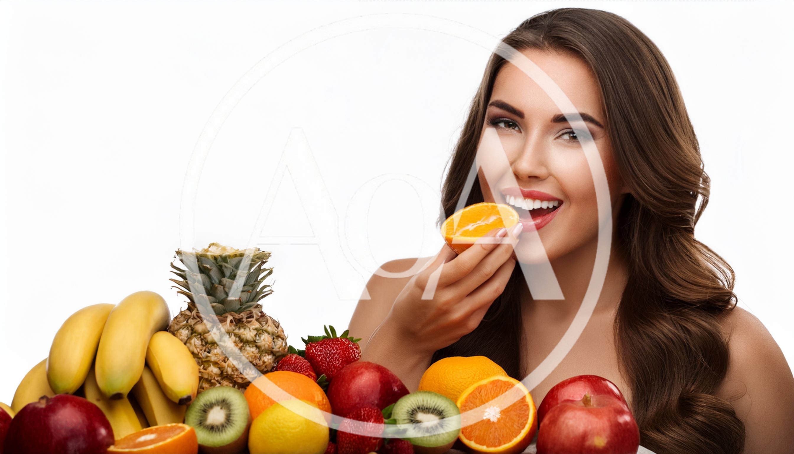 Beautiful Woman Eating Fresh Orange Slice With Fruit Assortment