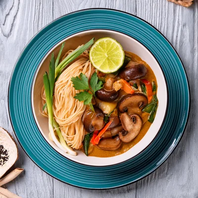 Bowl Of Thai Mushroom Curry With Rice Noodles