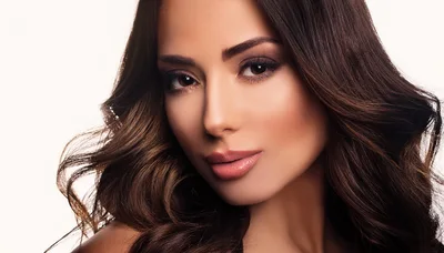 Portrait Of A Beautiful Woman With Wavy Brown Hair