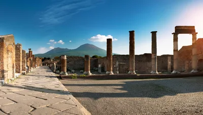 Ancient Roman Ruins Of Pompeii With Mount Vesuvius Background